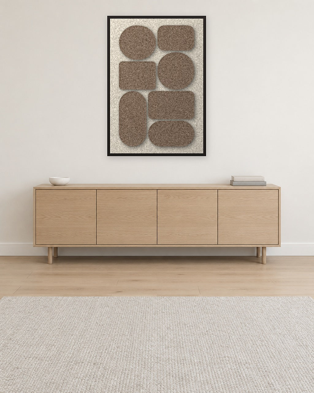 Panneau en feutre Monolith Cocoa avec cadre caisse noir au mur dans un intérieur scandinave